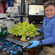 Peggy Whitson holds up Chinese cabbage grown in the International Space Station in a tweet sent on May 30, 2017. Photo: AP